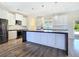 Bright kitchen with a large island, stainless steel appliances, modern pendants, and sleek cabinetry at 5500 Santovito St, Pahrump, NV 89061