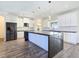 Gorgeous kitchen features a large island, stainless steel appliances, and stylish pendant lighting at 5500 Santovito St, Pahrump, NV 89061