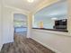 Open-concept living area with hardwood floors, modern finishes, and seamless flow to the kitchen at 5500 Santovito St, Pahrump, NV 89061