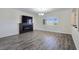 Bright living room featuring a modern fireplace, chandelier lighting, and large windows at 5500 Santovito St, Pahrump, NV 89061
