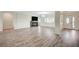 A spacious living room offers lots of natural light, hardwood floors and an electric fireplace at 5500 Santovito St, Pahrump, NV 89061