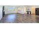 Spacious living room with modern fireplace, large windows, and elegant bar, perfect for entertaining at 5500 Santovito St, Pahrump, NV 89061