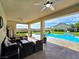 Expansive covered patio offers poolside views and comfortable seating for ultimate outdoor living at 5500 Santovito St, Pahrump, NV 89061