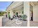 Charming covered patio offers ample space for outdoor living and entertaining with stylish patio furniture at 5500 Santovito St, Pahrump, NV 89061