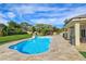 An inviting backyard pool and stone patio enhances the outdoor living space at 5500 Santovito St, Pahrump, NV 89061