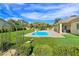 Backyard pool features beautiful landscaping and an elegant lounge area, ideal for outdoor relaxation at 5500 Santovito St, Pahrump, NV 89061