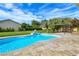 This luxurious pool includes a water feature and stylish hardscape at 5500 Santovito St, Pahrump, NV 89061