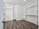 Spacious walk-in closet with custom shelving and hanging racks, offering ample storage space and organization at 5500 Santovito St, Pahrump, NV 89061