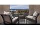 Relaxing covered balcony with comfortable seating offering neighborhood views at 5773 Crenellated St # Lot 57, Las Vegas, NV 89148
