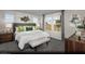 Serene main bedroom with plush bedding, elegant decor, and ample natural light at 5773 Crenellated St # Lot 57, Las Vegas, NV 89148