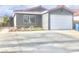 Charming single-story home with a well-maintained lawn and a two-car garage at 579 Grimsby Ave, Henderson, NV 89014