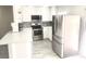 Updated kitchen featuring stainless steel appliances, modern countertops, and ample cabinet space at 579 Grimsby Ave, Henderson, NV 89014