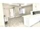 Bright living space with modern floors, large windows, and open access to the kitchen at 579 Grimsby Ave, Henderson, NV 89014