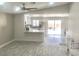 Bright, open-concept living space featuring modern flooring and an adjacent kitchen area at 579 Grimsby Ave, Henderson, NV 89014
