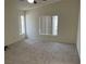 Spacious bedroom featuring new carpet, vaulted ceiling, and natural light at 6462 Saddle Up Ave # 103, Henderson, NV 89011