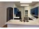 Bright kitchen featuring dark blue cabinetry, white countertops, and stainless steel appliances at 6462 Saddle Up Ave # 103, Henderson, NV 89011