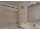 Bathroom featuring a shower and tub combination, along with a white sink and vanity at 6463 Big Pine Way, Las Vegas, NV 89108