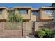 Charming townhome featuring a private fenced yard, mature landscaping, and a well-maintained facade at 6463 Big Pine Way, Las Vegas, NV 89108