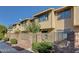 Charming townhome featuring a private fenced yard, mature landscaping, and a well-maintained facade at 6463 Big Pine Way, Las Vegas, NV 89108