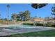 Community pool surrounded by mature trees and greenery, perfect for relaxation and outdoor enjoyment at 6463 Big Pine Way, Las Vegas, NV 89108