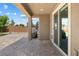 Relaxing covered back patio with brick pavers, perfect for outdoor dining and entertaining with convenient access to the house at 6783 Pleasant Flower St, Las Vegas, NV 89149