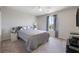 Cozy bedroom with carpet, ceiling fan, window and a queen size bed at 6783 Pleasant Flower St, Las Vegas, NV 89149