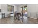 Cozy dining area with stylish table and chairs, tile flooring and natural light at 6783 Pleasant Flower St, Las Vegas, NV 89149