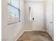 Bright entryway with tile flooring, white door, and a window at 6783 Pleasant Flower St, Las Vegas, NV 89149