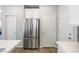 Bright kitchen with white cabinets and stainless steel refrigerator at 6783 Pleasant Flower St, Las Vegas, NV 89149