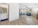 Open-concept living room with tile flooring, ample natural light, and modern furnishings at 6783 Pleasant Flower St, Las Vegas, NV 89149
