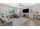 Bright living room featuring tile floors, comfortable seating, and recessed lighting at 6783 Pleasant Flower St, Las Vegas, NV 89149