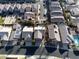 Aerial view of a neighborhood featuring well-maintained homes with pools and desert landscaping at 74 Harbor Coast St, Las Vegas, NV 89148