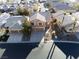 Aerial view of a well-maintained suburban home with a three-car garage and mature landscaping at 74 Harbor Coast St, Las Vegas, NV 89148