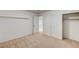 Comfortable bedroom featuring neutral carpet, closet, and a doorway, ready for your personal touch at 74 Harbor Coast St, Las Vegas, NV 89148