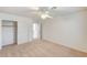 Cozy bedroom with a ceiling fan, closet, and an open doorway, perfect for relaxation and storage at 74 Harbor Coast St, Las Vegas, NV 89148