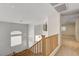 Upstairs landing area showcasing bright natural light and neutral carpet at 74 Harbor Coast St, Las Vegas, NV 89148