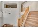 Carpeted staircase leading to upper level, natural wood railing at 74 Harbor Coast St, Las Vegas, NV 89148