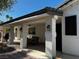 Covered back porch with outdoor seating, and stylish lighting, perfect for relaxation at 7461 Tahoe Basin Dr, Las Vegas, NV 89129
