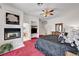 Spacious bedroom featuring a fireplace and view into the on-suite bathroom at 7461 Tahoe Basin Dr, Las Vegas, NV 89129
