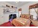 Comfortable bedroom with decorative shelves, a bed with stylish linens, and soft lighting at 7461 Tahoe Basin Dr, Las Vegas, NV 89129