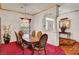 Traditional dining room with wood table, chairs, and adjacent entryway at 7461 Tahoe Basin Dr, Las Vegas, NV 89129