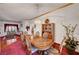 Spacious dining area with formal table set, red carpet, and natural light at 7461 Tahoe Basin Dr, Las Vegas, NV 89129