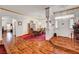 Elegant dining room features wood floors, red carpet, table, and chandelier at 7461 Tahoe Basin Dr, Las Vegas, NV 89129