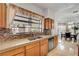 Well-appointed kitchen showcasing granite countertops, wood cabinetry, and a bright window over the sink area at 7461 Tahoe Basin Dr, Las Vegas, NV 89129