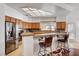 Bright kitchen with stainless steel appliances, bar stools, and a functional layout for easy meal preparation at 7461 Tahoe Basin Dr, Las Vegas, NV 89129