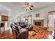 Large living area with brick fireplace and sectional couch at 7461 Tahoe Basin Dr, Las Vegas, NV 89129