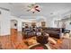 Open living space featuring a brick fireplace and sectional couch at 7461 Tahoe Basin Dr, Las Vegas, NV 89129