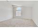 Bright secondary bedroom with vaulted ceiling and neutral paint at 7813 Paper Flower Ct, Las Vegas, NV 89128