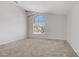 Bright bedroom with vaulted ceiling and arch window allowing natural light at 7813 Paper Flower Ct, Las Vegas, NV 89128