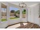 Eat-in kitchen area with a view to the backyard through two large windows and pantry at 7813 Paper Flower Ct, Las Vegas, NV 89128